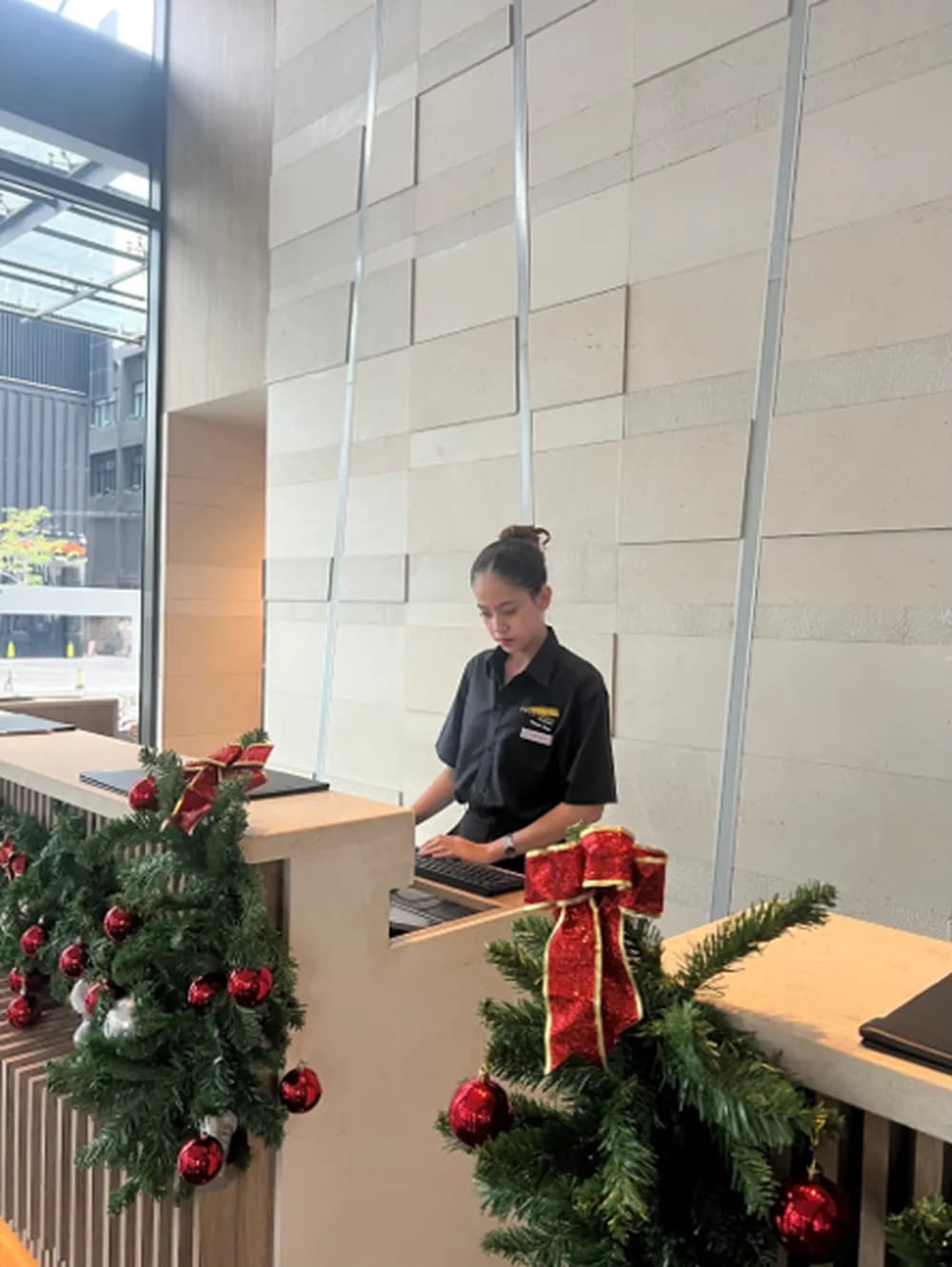 EAMU intern working at the Courtyard by Marriott Phnom Penh front desk